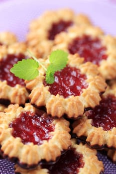 Chocolate dipped butter cookies with jam center