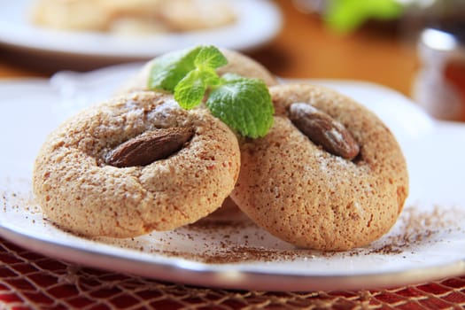 Crispy almond macaroons on a plate - detail