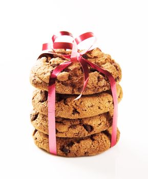 Chocolate chip cookies tied with a red ribbon
