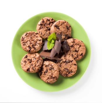 Chocolate chip cookies on a green plate - overhead