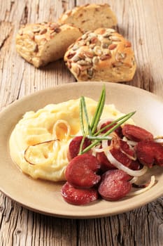 Mashed potato and slices of roasted sausage