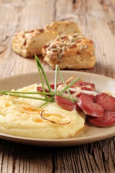 Mashed potato and slices of roasted sausage