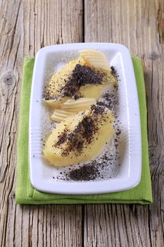 Sweet potato dumplings with poppyseed, sugar and butter