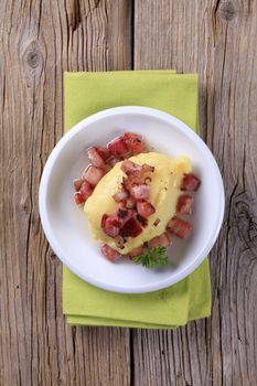 Dish of mashed potato and diced smoked pork