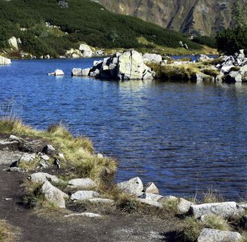 background detail Autumn mountain lakes with blue surface