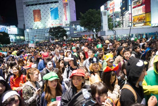 JAPAN, Tokyo : People wear costumes as they take part in a Halloween parade in Tokyo on October 31, 2015. Tens of thousands of people gathered at Tokyo's Shibuya fashion district to celebrate Halloween.
