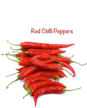 Stack of Ripe Red Chili Peppers In a Row with Inscription isolated on white background