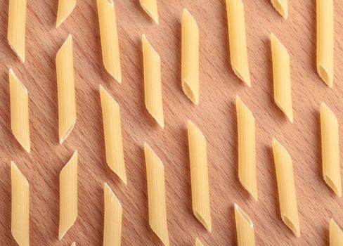 raw the pasta closeup on wooden background 