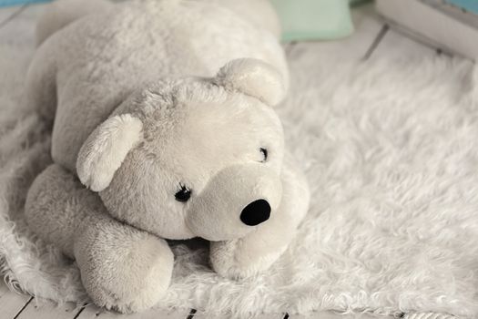 white soft toy bear in a children's room