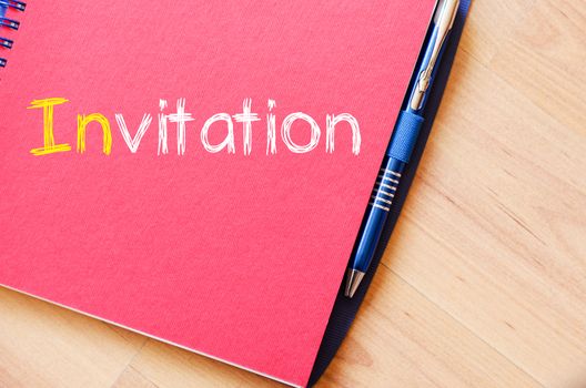 Invitation text concept write on notebook