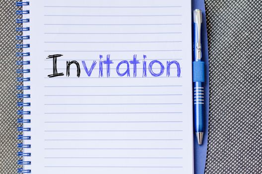 Invitation text concept write on notebook