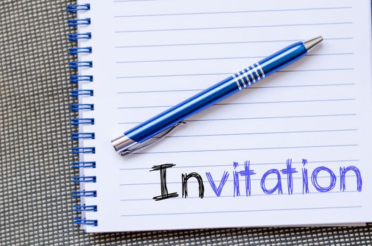 Invitation text concept write on notebook