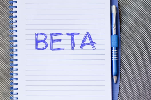Beta text concept write on notebook