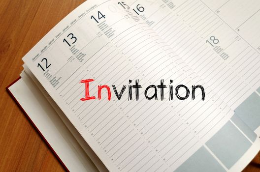 Invitation text concept write on notebook