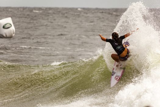 SNAPPER ROCKS, GOLD COAST, AUSTRALIA - 9 MARCH: Unidentified Surfer races the Quicksilver & Roxy Pro World Title Event. 9 March 2013, Snapper Rocks, Gold Coast, Australia