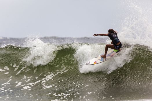 SNAPPER ROCKS, GOLD COAST, AUSTRALIA - 9 MARCH: Unidentified Surfer races the Quicksilver & Roxy Pro World Title Event. 9 March 2013, Snapper Rocks, Gold Coast, Australia