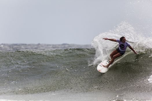 SNAPPER ROCKS, GOLD COAST, AUSTRALIA - 9 MARCH: Unidentified Surfer races the Quicksilver & Roxy Pro World Title Event. 9 March 2013, Snapper Rocks, Gold Coast, Australia