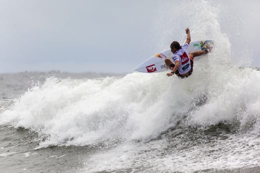 SNAPPER ROCKS, GOLD COAST, AUSTRALIA - 9 MARCH: Unidentified Surfer races the Quicksilver & Roxy Pro World Title Event. 9 March 2013, Snapper Rocks, Gold Coast, Australia