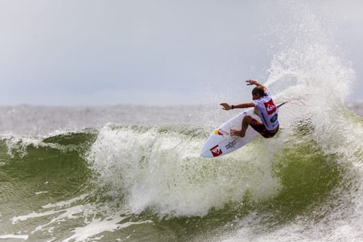 SNAPPER ROCKS, GOLD COAST, AUSTRALIA - 9 MARCH: Unidentified Surfer races the Quicksilver & Roxy Pro World Title Event. 9 March 2013, Snapper Rocks, Gold Coast, Australia