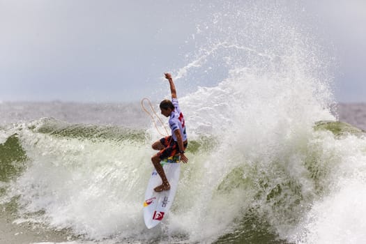 SNAPPER ROCKS, GOLD COAST, AUSTRALIA - 9 MARCH: Unidentified Surfer races the Quicksilver & Roxy Pro World Title Event. 9 March 2013, Snapper Rocks, Gold Coast, Australia