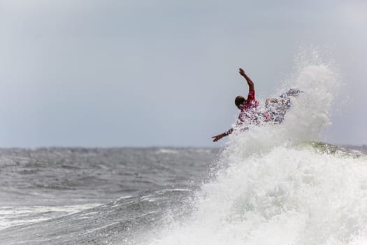 SNAPPER ROCKS, GOLD COAST, AUSTRALIA - 9 MARCH: Unidentified Surfer races the Quicksilver & Roxy Pro World Title Event. 9 March 2013, Snapper Rocks, Gold Coast, Australia