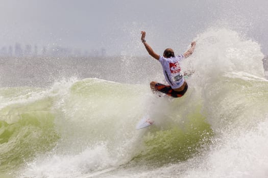 SNAPPER ROCKS, GOLD COAST, AUSTRALIA - 9 MARCH: Unidentified Surfer races the Quicksilver & Roxy Pro World Title Event. 9 March 2013, Snapper Rocks, Gold Coast, Australia