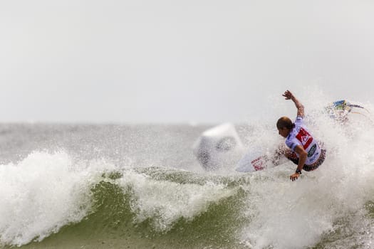 SNAPPER ROCKS, GOLD COAST, AUSTRALIA - 9 MARCH: Unidentified Surfer races the Quicksilver & Roxy Pro World Title Event. 9 March 2013, Snapper Rocks, Gold Coast, Australia