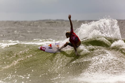 SNAPPER ROCKS, GOLD COAST, AUSTRALIA - 9 MARCH: Unidentified Surfer races the Quicksilver & Roxy Pro World Title Event. 9 March 2013, Snapper Rocks, Gold Coast, Australia