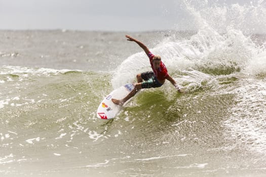 SNAPPER ROCKS, GOLD COAST, AUSTRALIA - 9 MARCH: Unidentified Surfer races the Quicksilver & Roxy Pro World Title Event. 9 March 2013, Snapper Rocks, Gold Coast, Australia