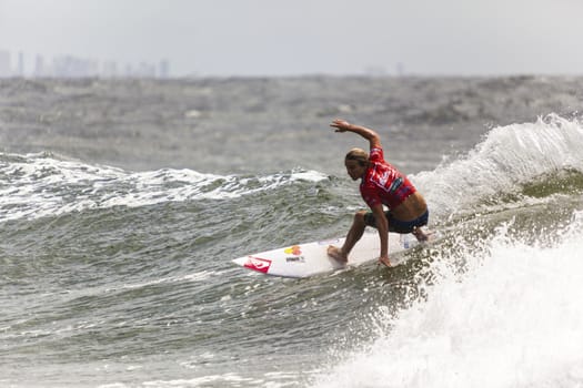 SNAPPER ROCKS, GOLD COAST, AUSTRALIA - 9 MARCH: Unidentified Surfer races the Quicksilver & Roxy Pro World Title Event. 9 March 2013, Snapper Rocks, Gold Coast, Australia