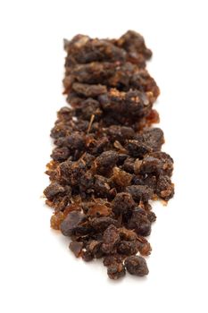 Row of Organic Indian bdellium or Guggul resin (Commiphora wightii) isolated on white background.