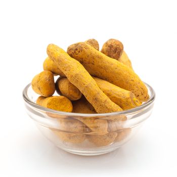 Front view of Organic Long Turmeric or Haldi (Curcuma longa) in glass bowl isolated on white background.