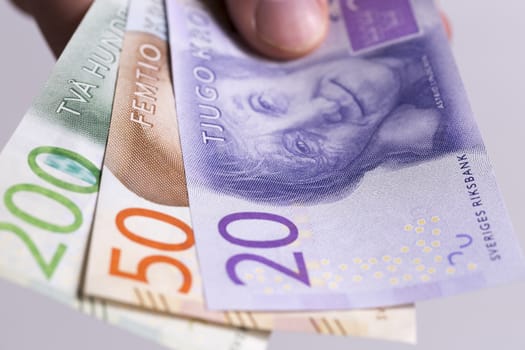 Swedish Currency New 20, 50, 200 note close up. Helt in hand. Introduced in 2015.
