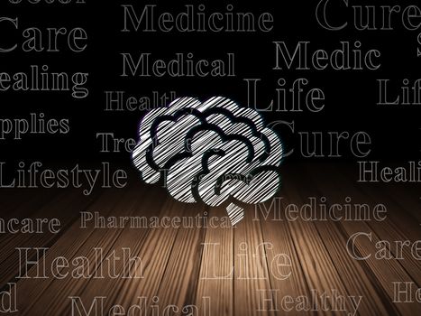 Health concept: Glowing Brain icon in grunge dark room with Wooden Floor, black background with  Tag Cloud