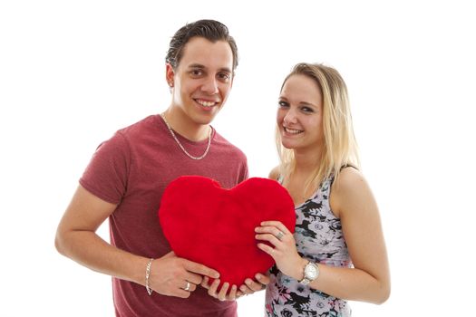 Couple in love holding a red heart over white background