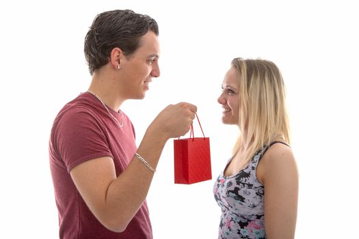 Man is giving present to his girlfriend isolated on white background