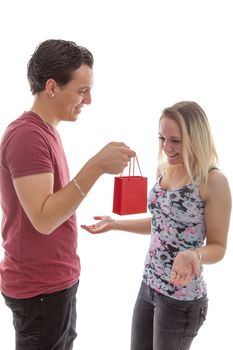 Man is giving present to his girlfriend isolated on white background