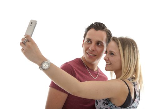 Young couple making selfie over white background