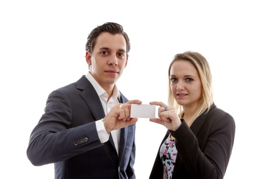 young business couple holding empty card for your own text over white background