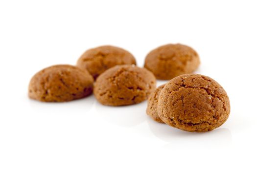 Typical dutch sweets: pepernoten (ginger nuts) for a celebration at 5 december in the Netherlands over white background