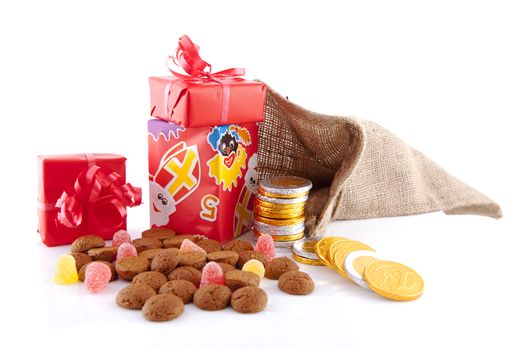 Typical Dutch celebration: Sinterklaas with surprises in bag and ginger nuts, ready for the kids in december. Isolated on white background