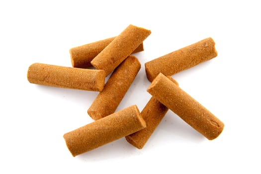 Bunch of cinnamon sticks over white background