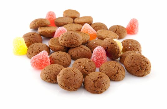 Typical dutch sweets: pepernoten (ginger nuts) for a celebration at 5 december in the Netherlands over white background