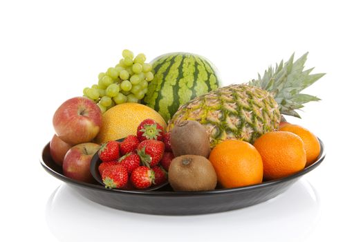 Big plate with lots of healthy fruits over white background