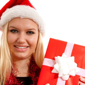 portrait of blonde woman with christmas hat and present over white background