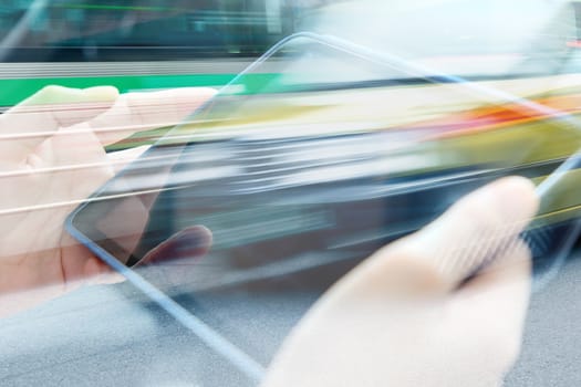 businesswomen Using digital tablet double exposure and blurred view of car on city street
