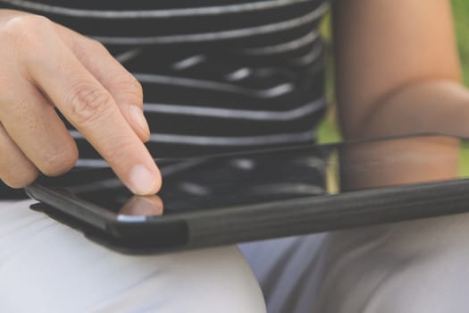 close up of people using digital tablet background
