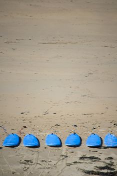 surf boards on the beach in ballybunion ready for a surf schools lessons