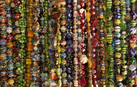 A large number of beads of different colors and shapes for sale.