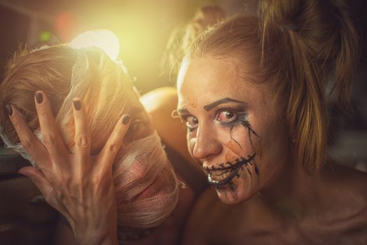 Horrible girl with her boyfriend, zombie halloween theme